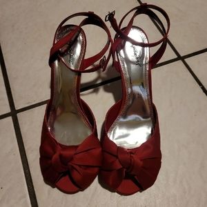 Red satin heels with bow